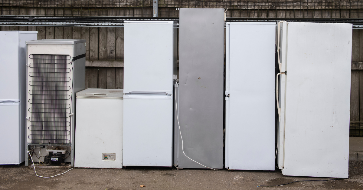 photo of 7 fridges lined up ready to be recycled