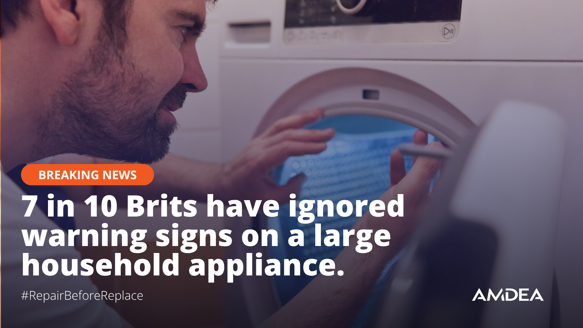 repair engineer looking into a washing machine